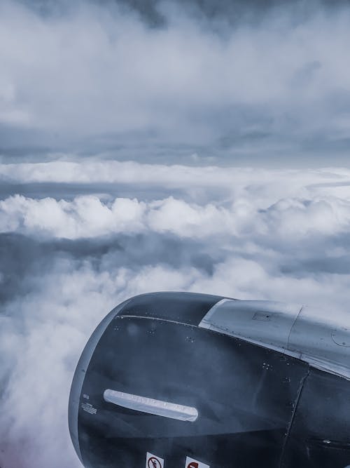 Engine turbine of plane in clouds