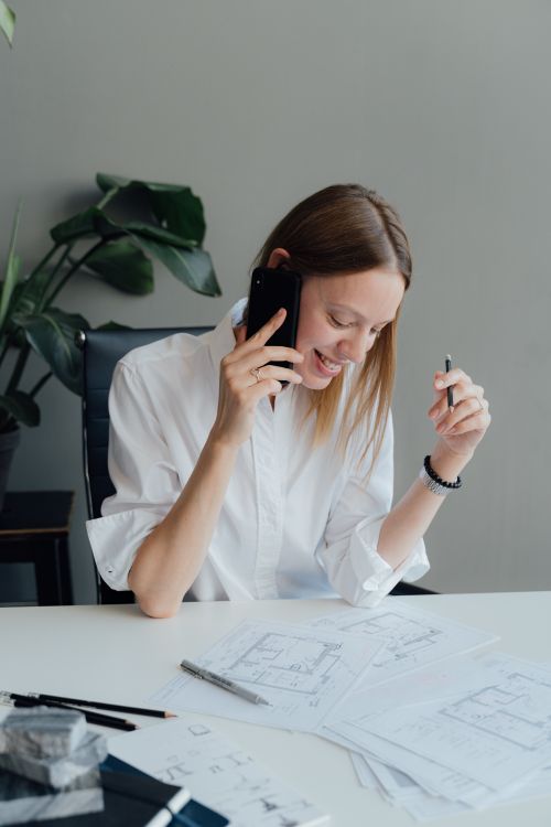 Female Architect having a Phone Call · Free Stock Photo