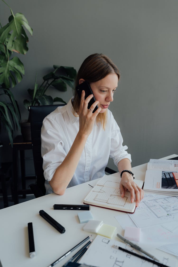 Female Architect Having A Phone Call 