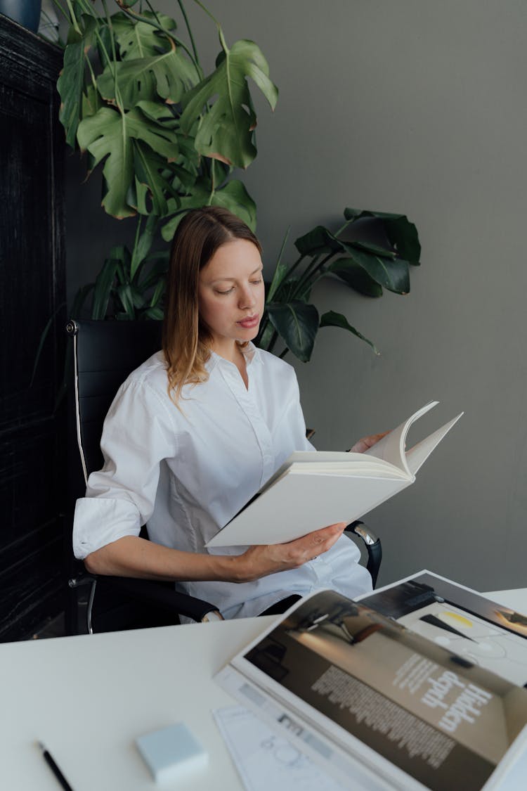 Female Professional Reading A Book 