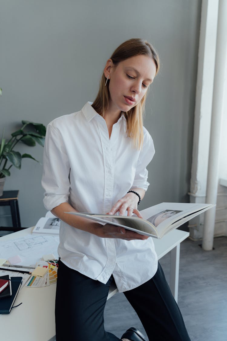 Female Professional Reading A Book 