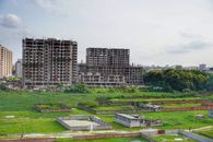 City Buildings Near Green Grass Field