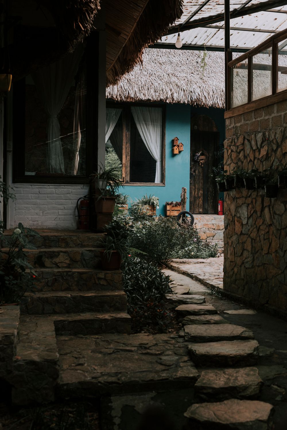 Natural stone walkway leading through a landscaped property