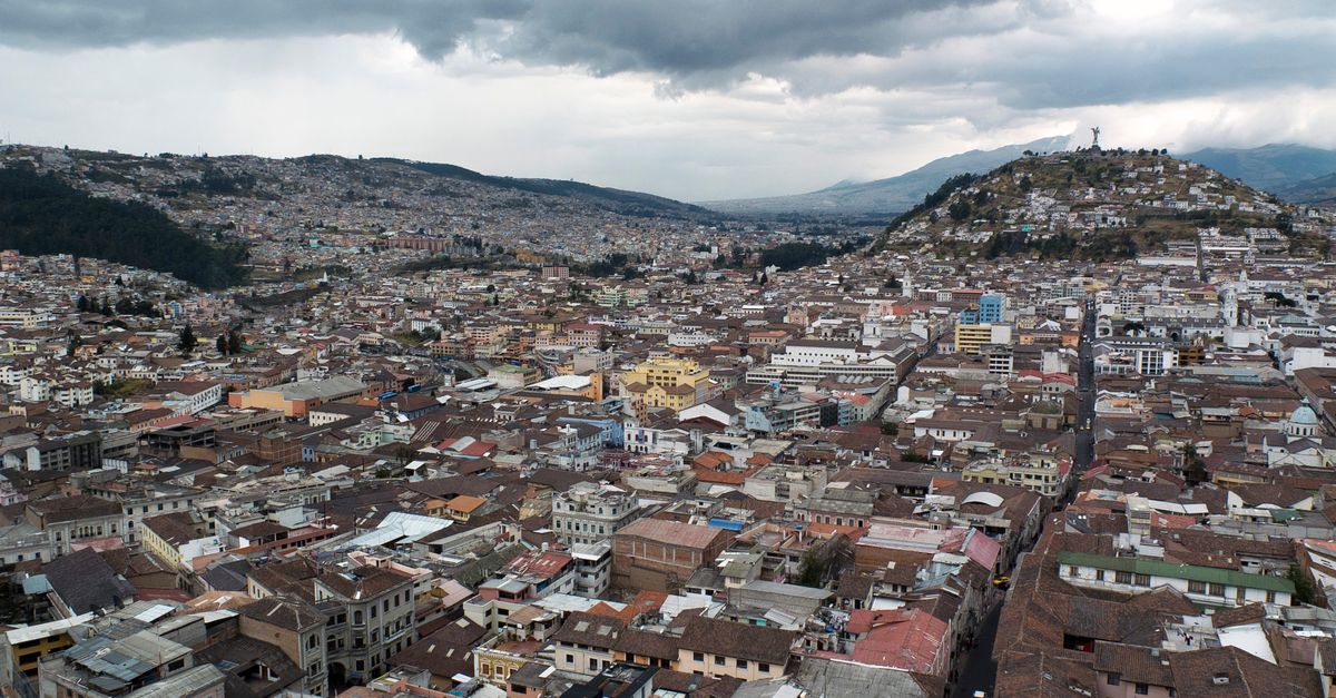 Quito colonial Centro Histórico with Baroque church domes and mountain backdrop