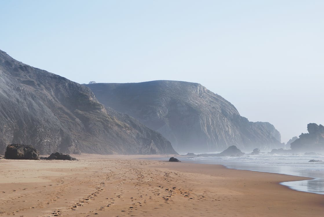 Free Mountains Near Body of Water Stock Photo