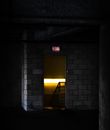 Yellow and Black Door on Gray Brick Wall