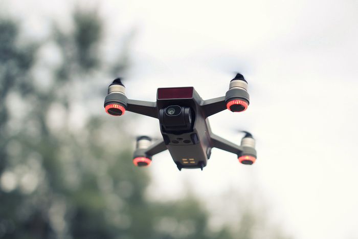 A black and red quadcopter drone