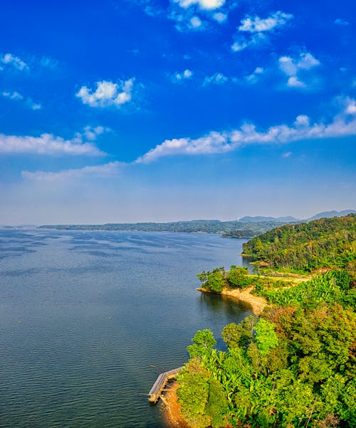 White Clouds on Blue Sky over a Lake