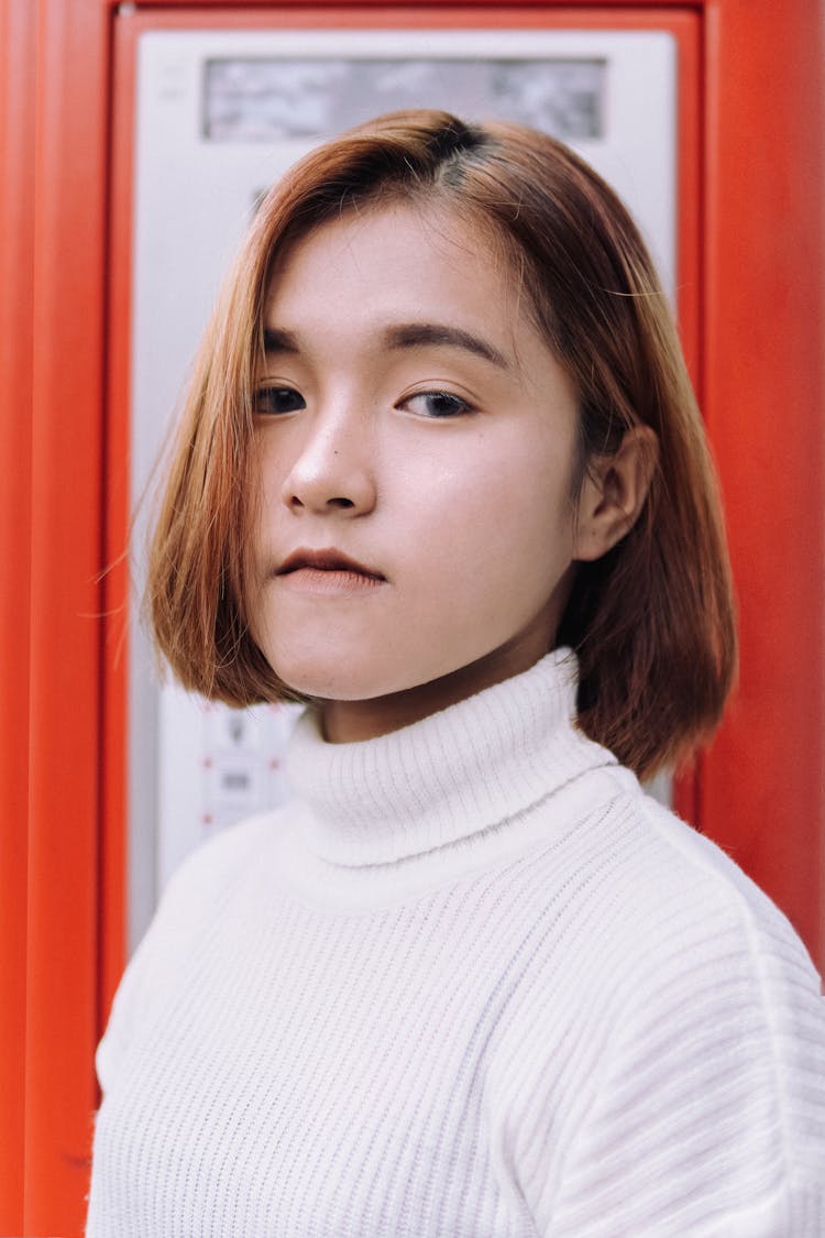 Young Woman Wearing A White Turtleneck 