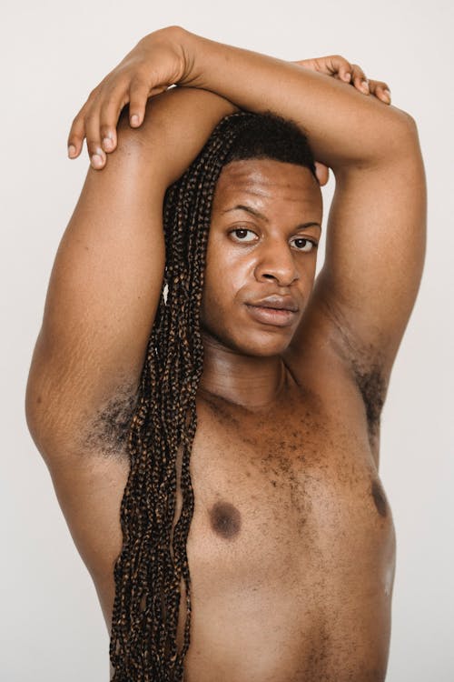 Topless Man in Afro Braid Posing Sexily at the Camera