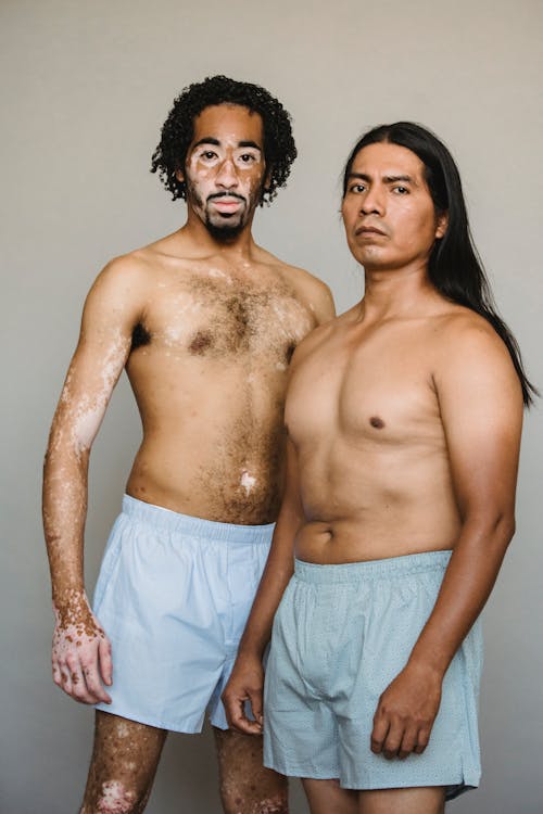 Free Unemotional diverse men in underpants in studio Stock Photo