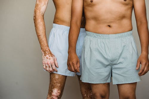 Free Crop unrecognizable men in boxer shorts Stock Photo