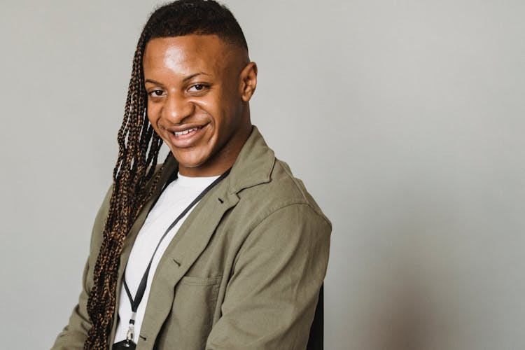 Happy Feminine Black Man In Studio