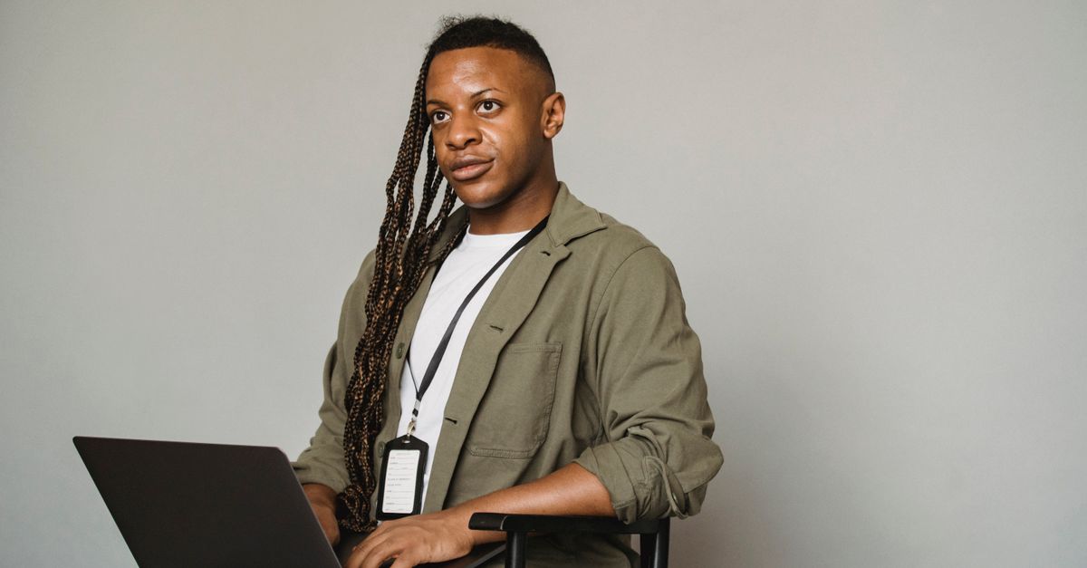 Trans Guy Computer Llockscreen Black transgender man working on laptop ยท Free Stock Photo