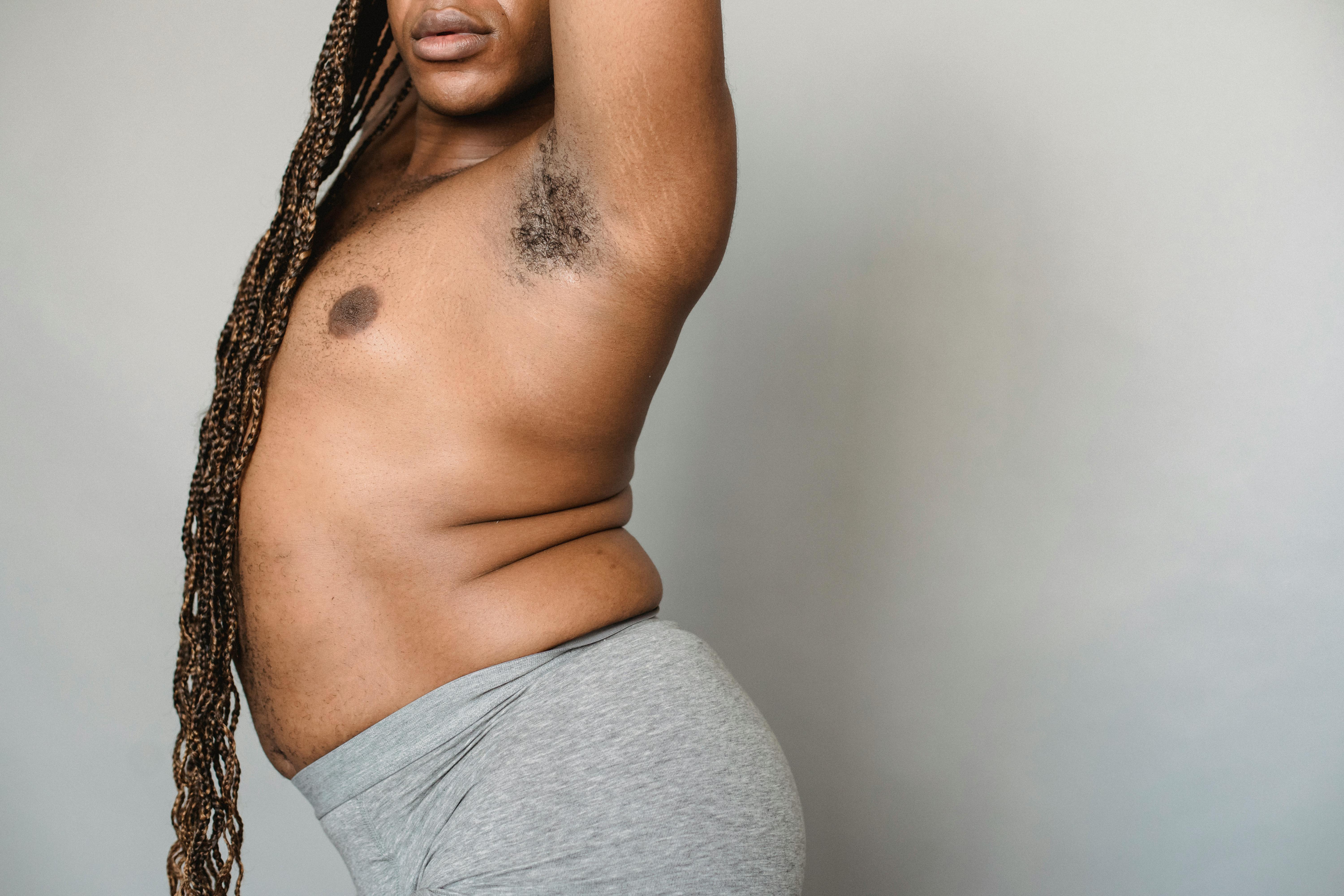 Crop overweight black transgender man in underwear in studio · Free Stock Photo photo