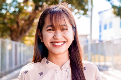 Happy Asian woman on street