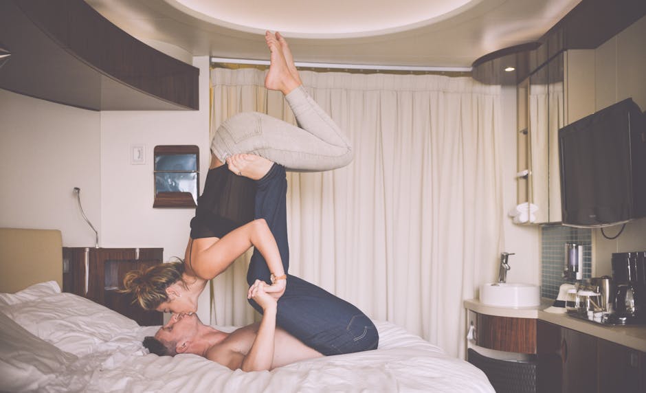 Man Kissing a Woman Lying on Bed