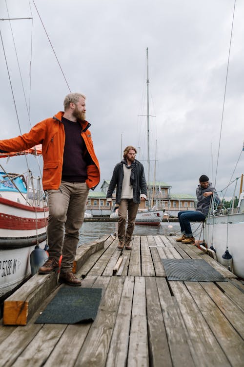 Men standing on a Wooden Dock 
