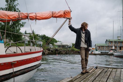 Man standing on a Wooden Dock 