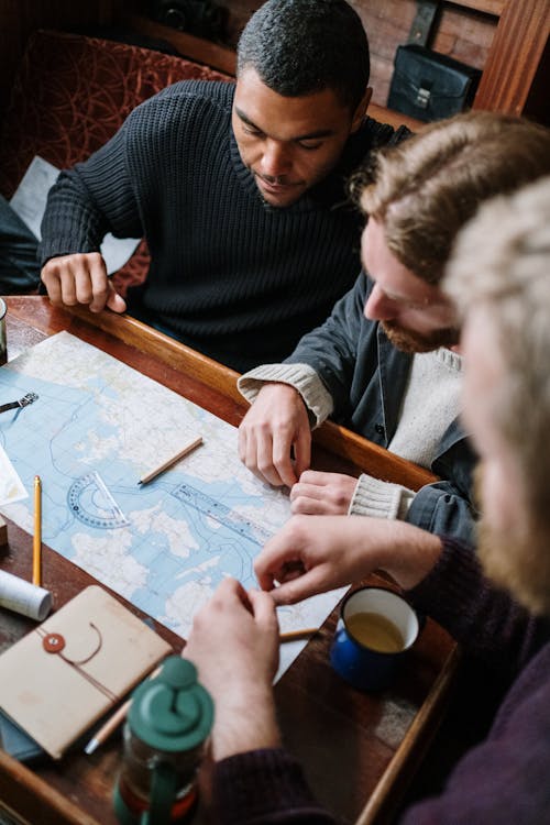 Men looking on a Map 