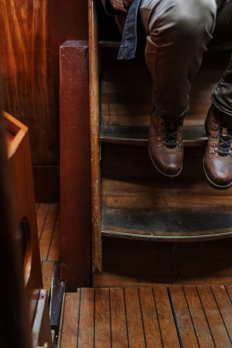 Wearing printed boots on a stairwell — photo by cottonbro studio on Pexels