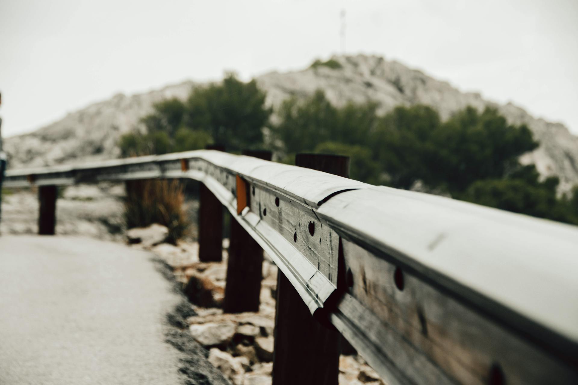Close-up of a metal guardrail on a mountain road in Mallorca, Spain.