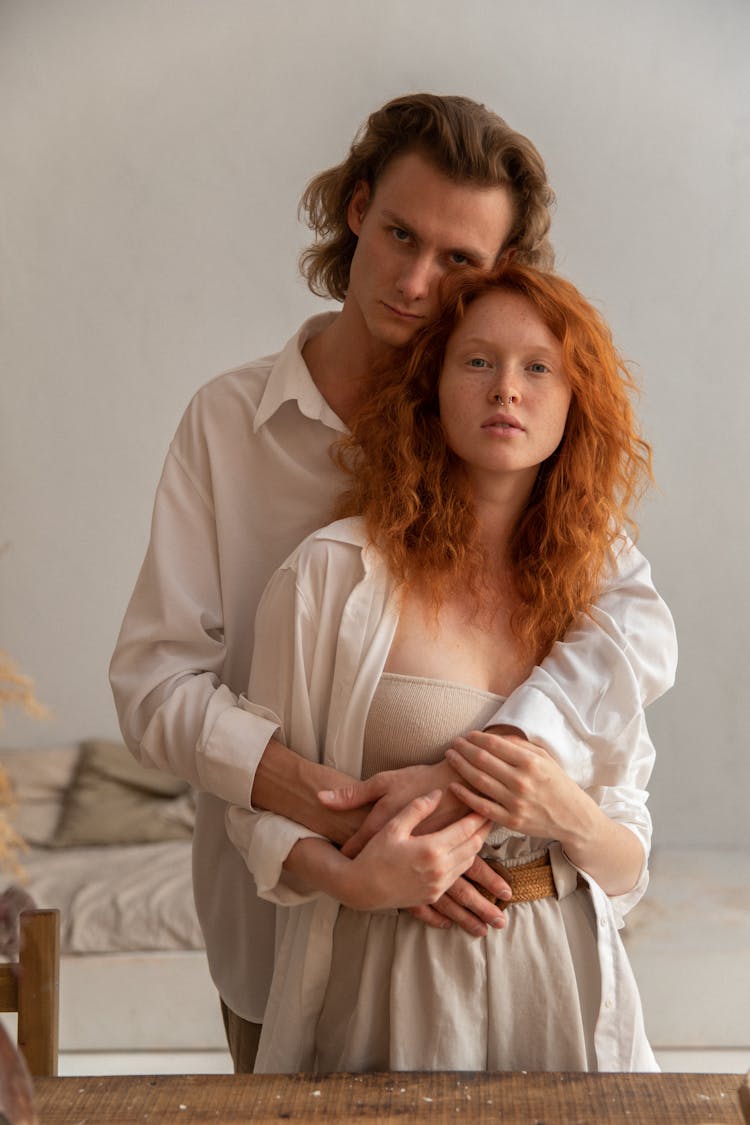 Loving Couple Embracing Gently In Studio