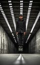 Man in Black Jacket Walking on Tunnel