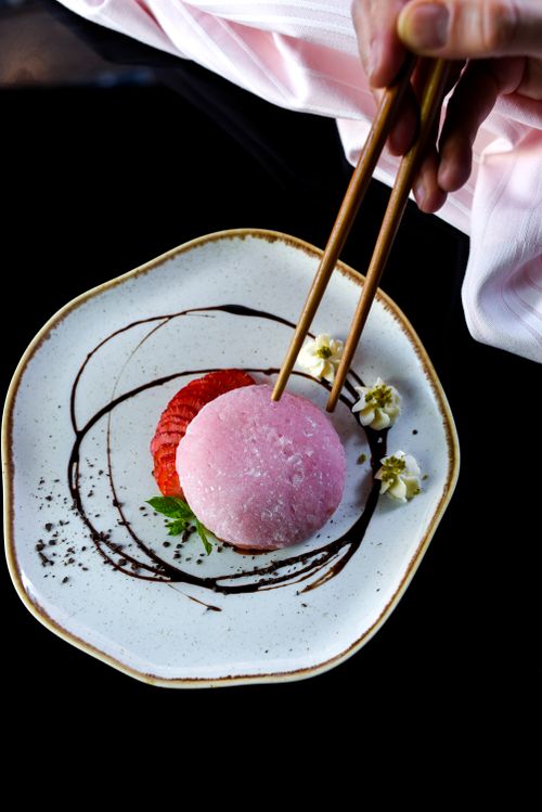 Free Delicate mochi dessert with strawberries on a decorative plate, captured in Turkey. Stock Photo
