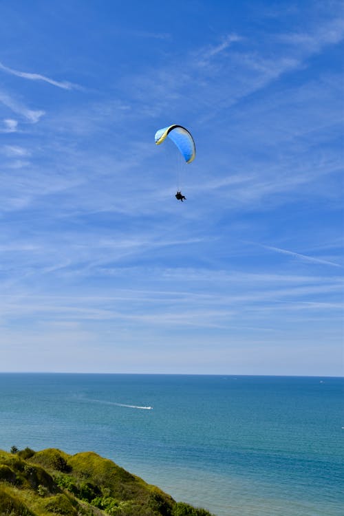 Free Person Skydiving Over Sea Stock Photo