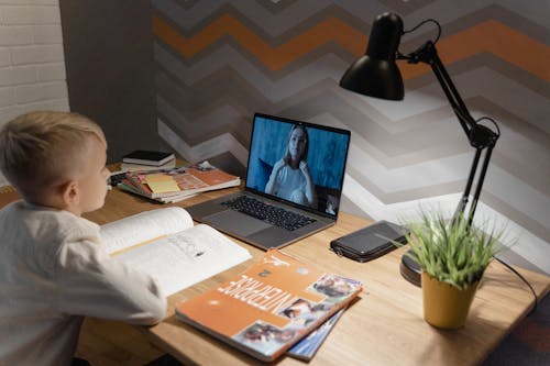 A Kid in a Video Call With His Teacher