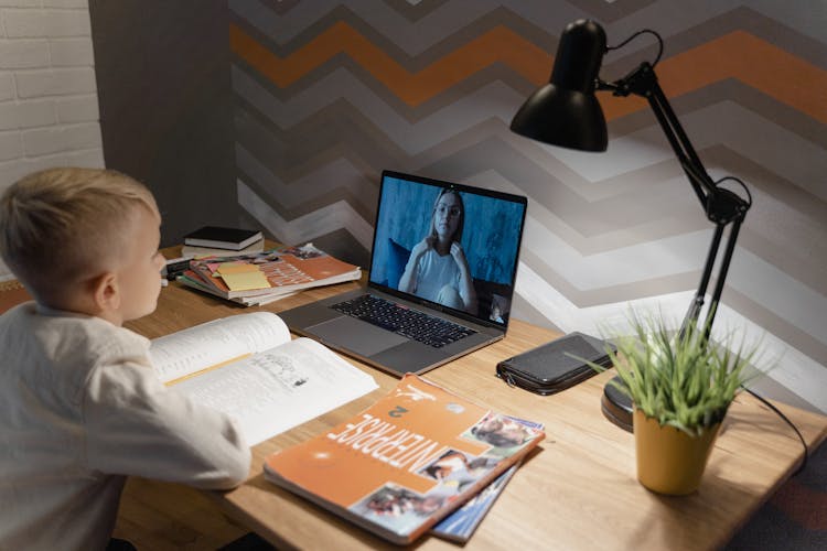 A Kid In A Video Call With His Teacher