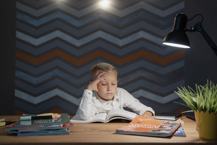 A Kid Reading A Book