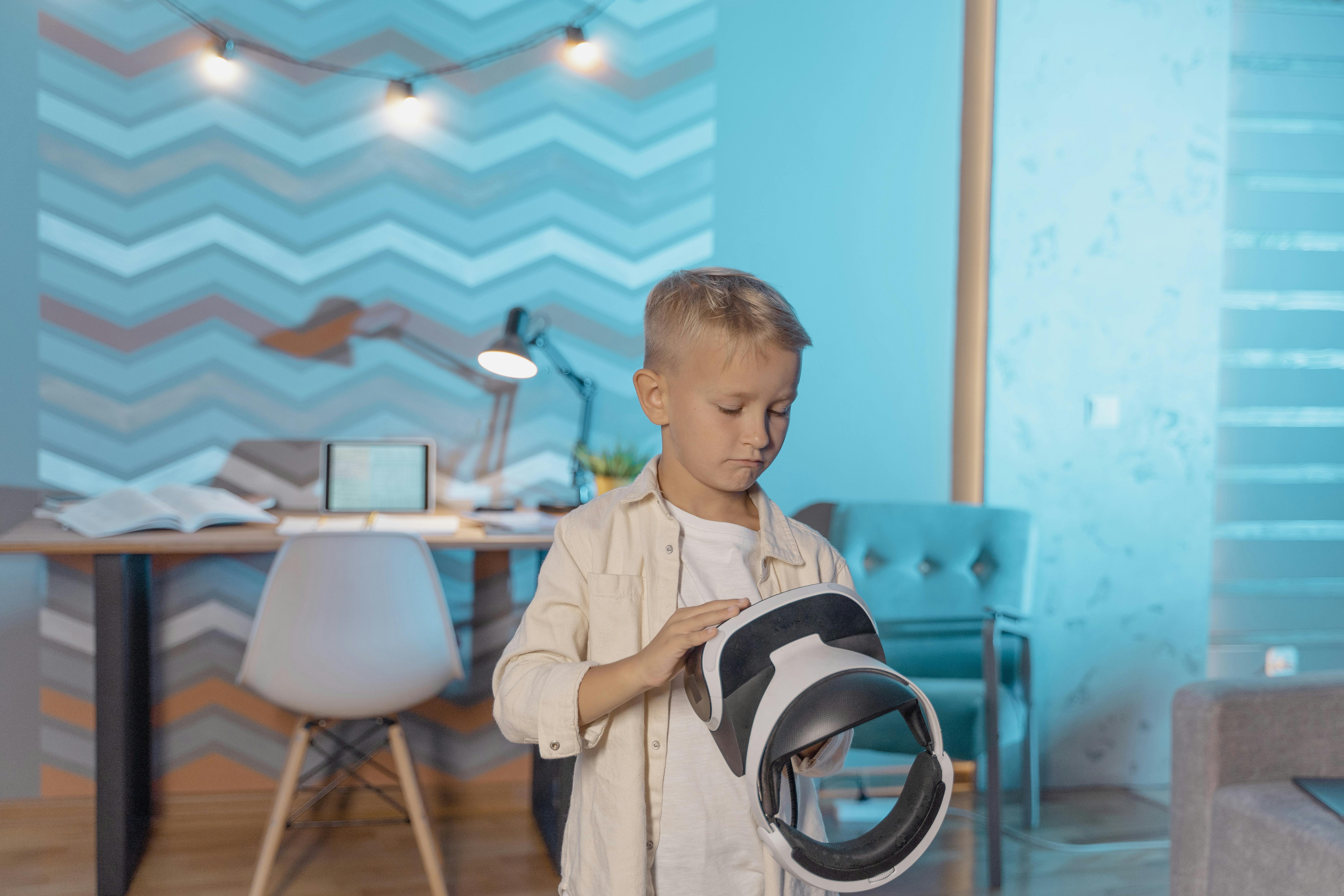 a kid holding a vr headset