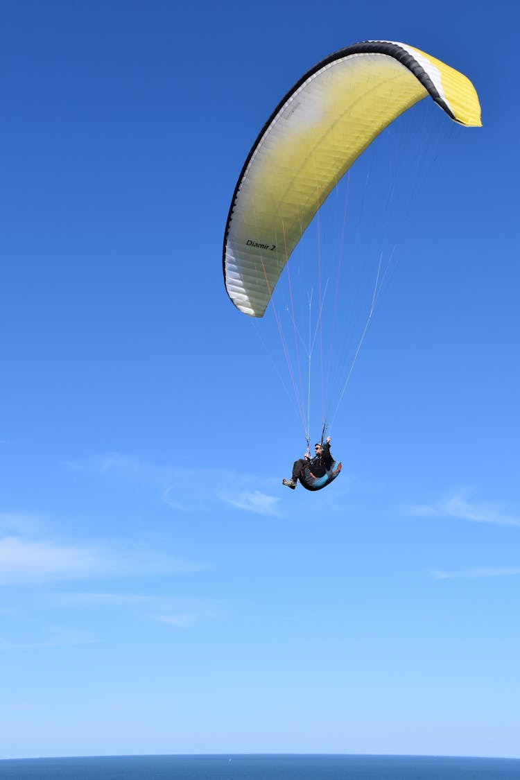 Person Riding A Paraglide