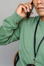 Crop man talking on mobile phone
