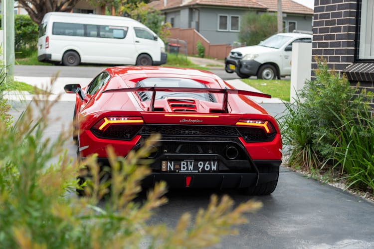 Red Sportscar Parked On The Driveway