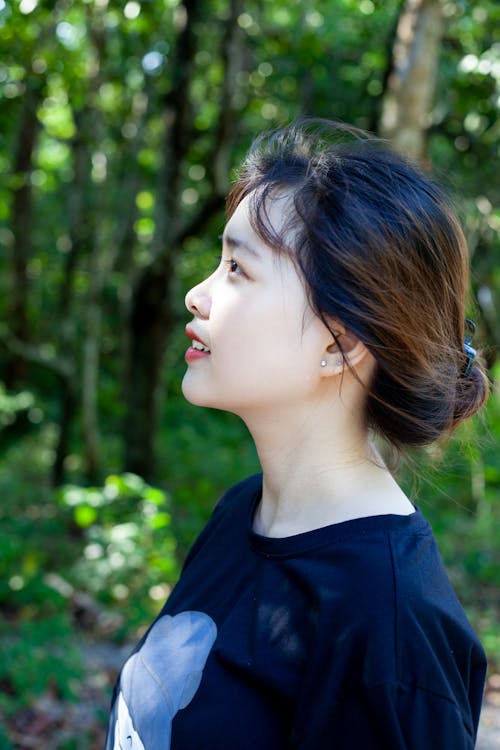 Side Portrait of Brunette Woman in Park