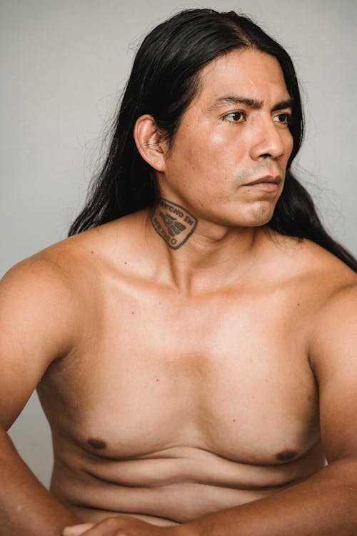 Naked American Indian man with long dark hair