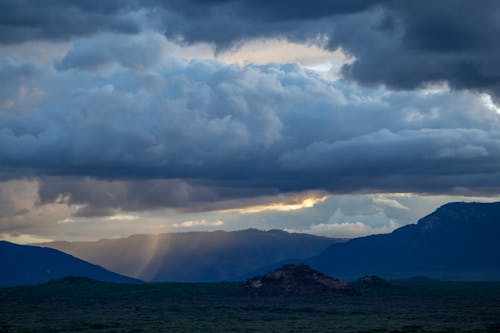 Mountain Ranges Under White Clouds