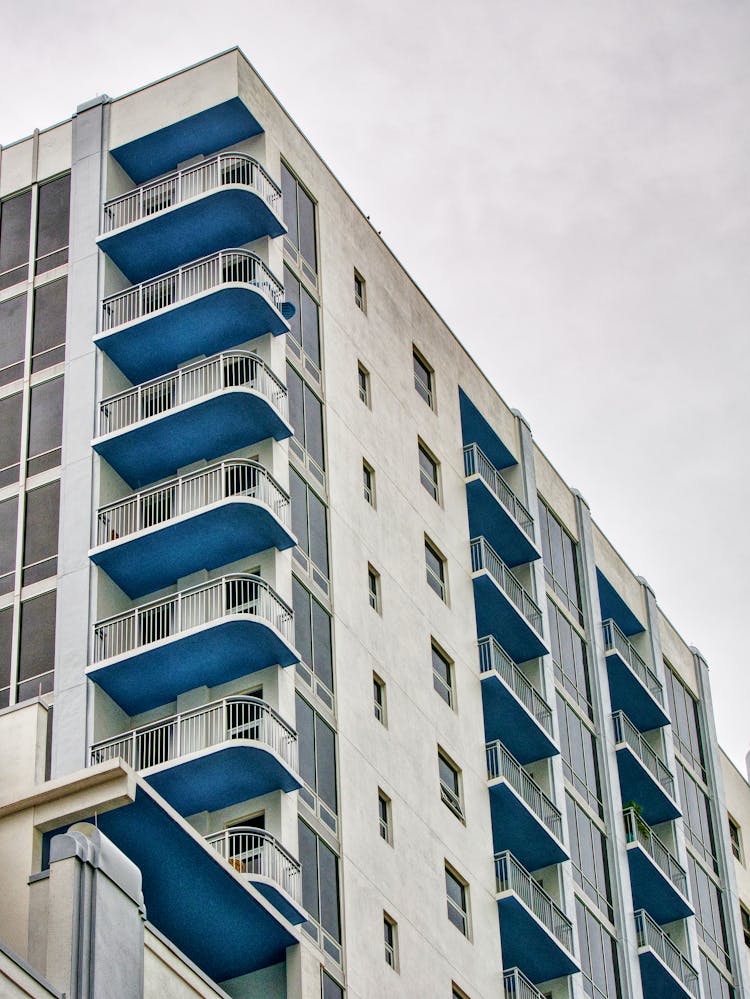 Low Angle Shot Of A White And Blue Building