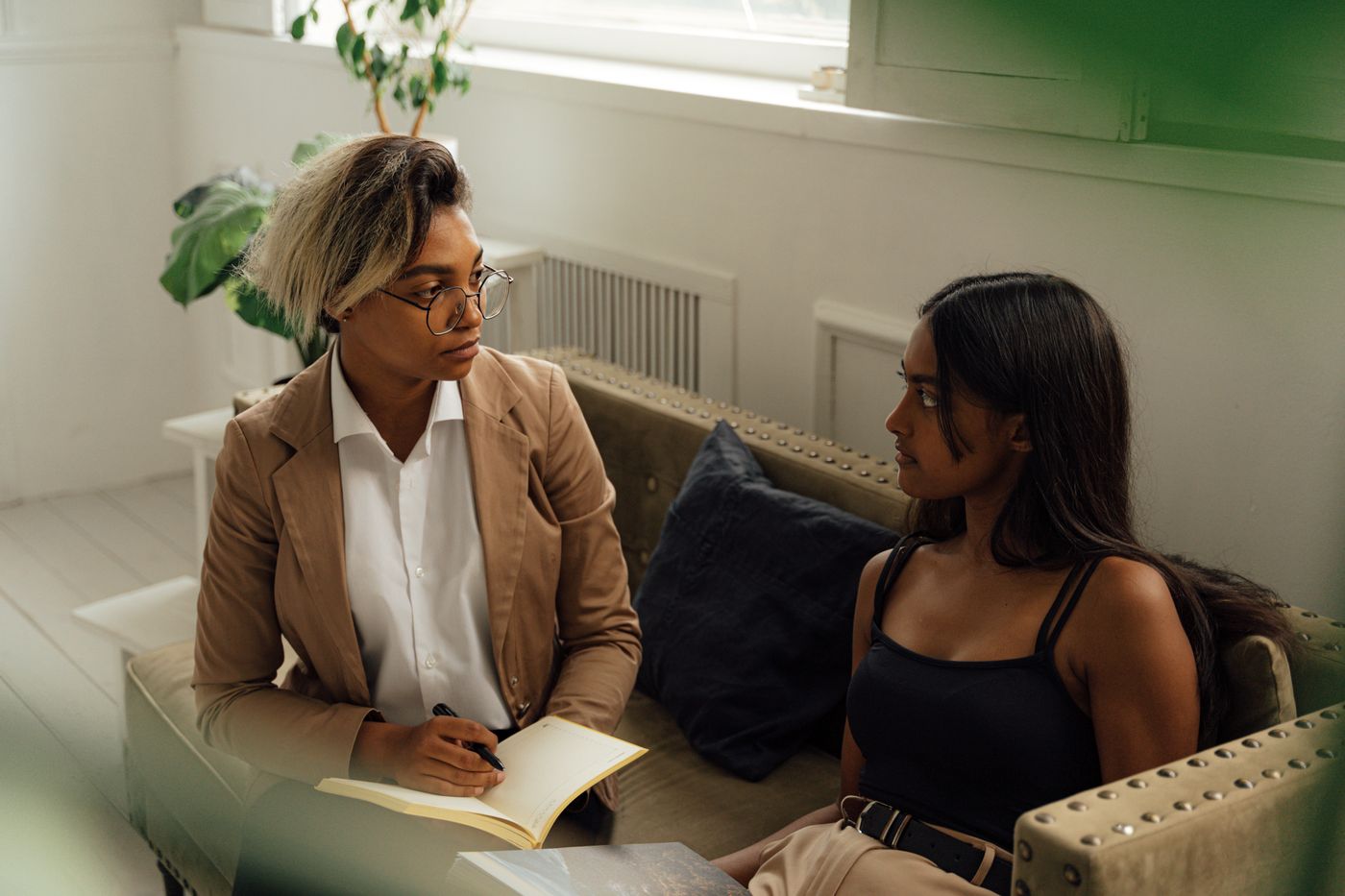 Mentor speaking with a teenage young person in a one-to-one support session