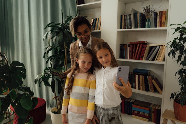 A Teacher And Students Taking A Selfie Together