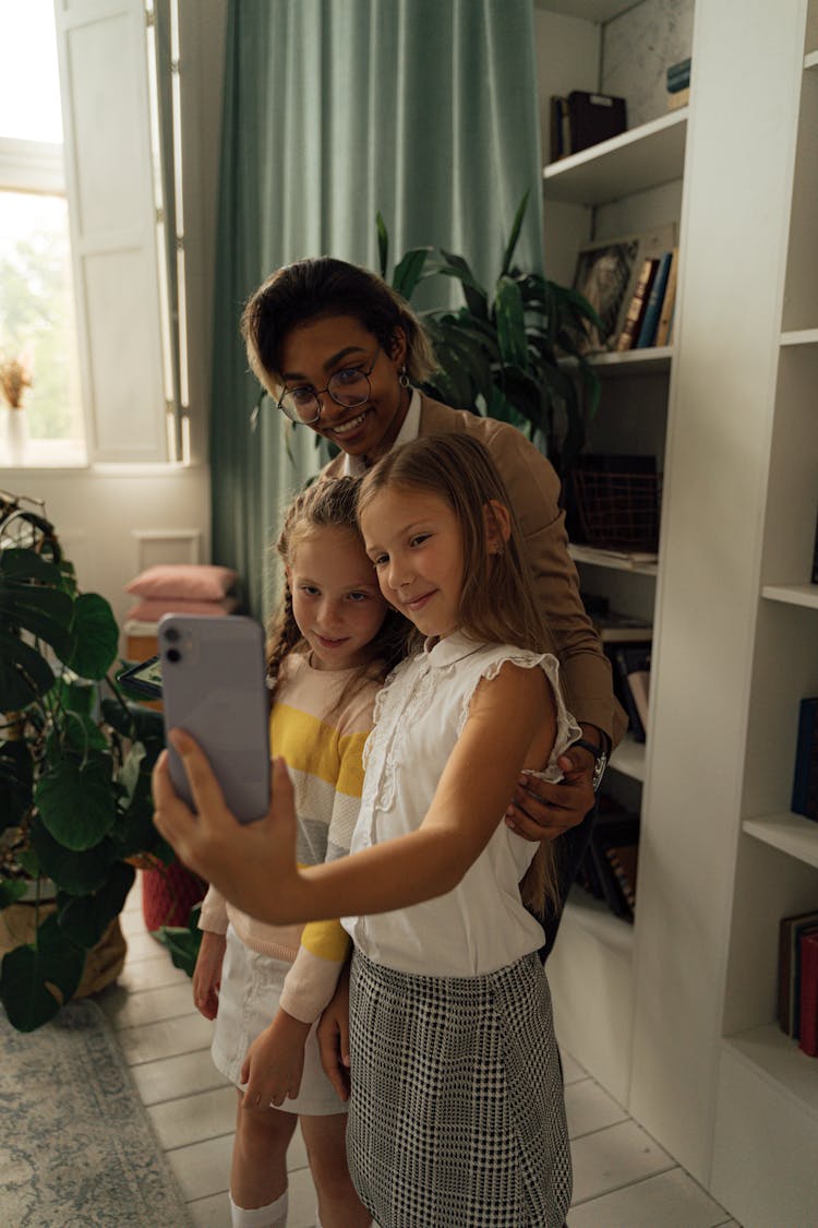 A Teacher And Students Taking A Selfie Together