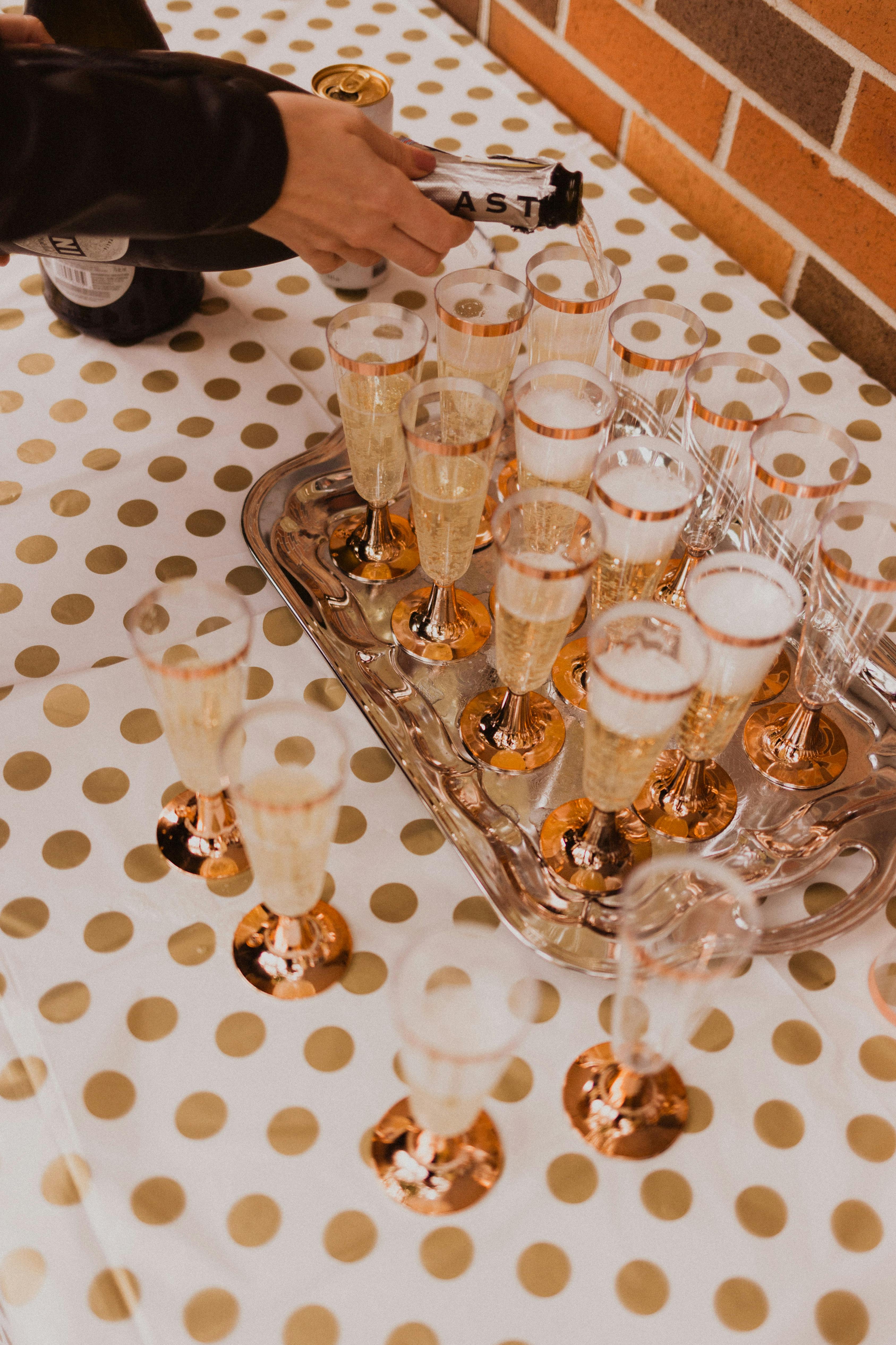 crop person serving refreshing aperitif on table