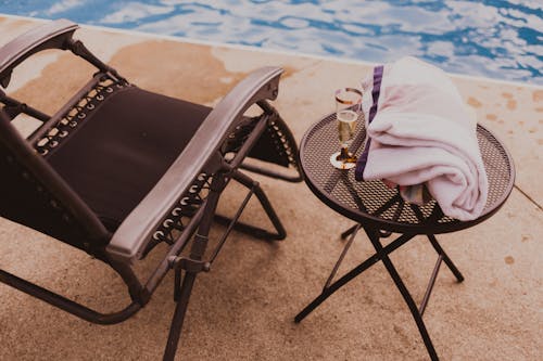 Free Lounging zone with champagne in poolside Stock Photo