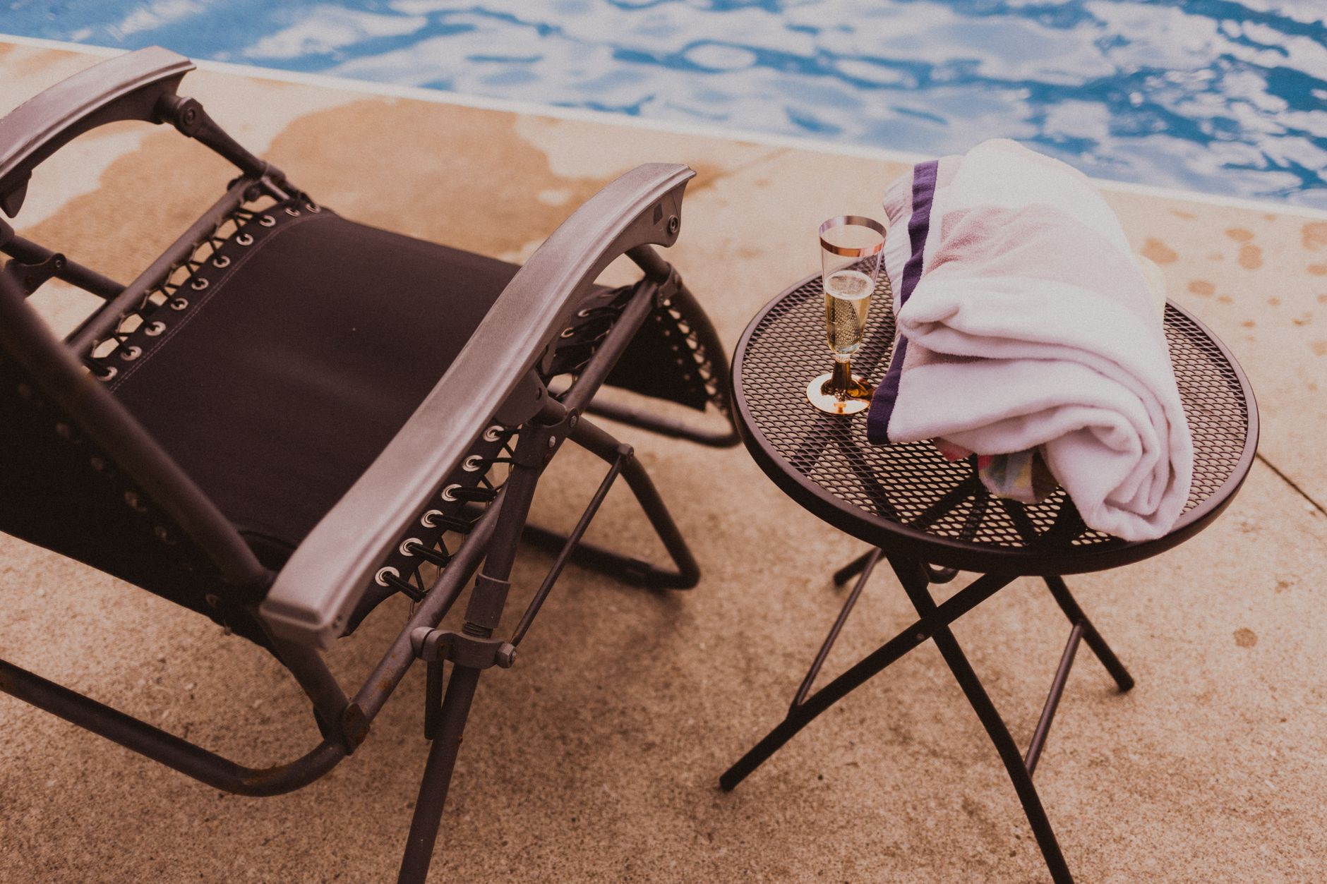 Elegant poolside lounge chair with towel at a spa day Malta without hotel stay experience