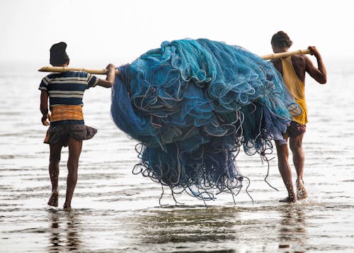 Fishermen Carrying Fishing Nets