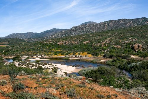 Free Discover the lush landscapes and tranquil stream of Clanwilliam Nature Reserve, South Africa's hidden gem. Stock Photo