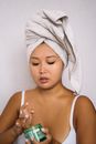 Woman in White Tank Top With Towel on Head